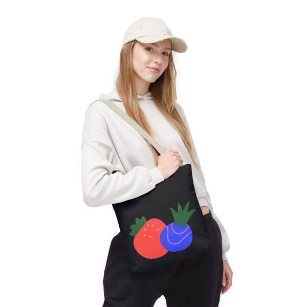 fruit graphic tote bag — colorful strawberry & plum illustration on black
